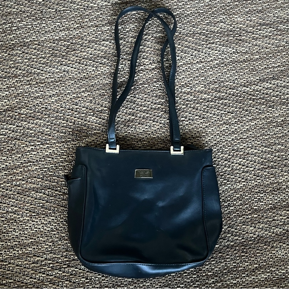 The Filer black shoulder bag with sleek design and silver hardware